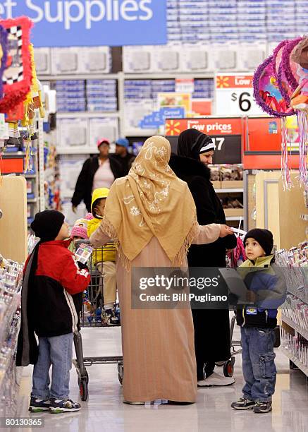 Arabic women shop at a new multilingual Wal-Mart that will stock the largest selection of Middle Eastern food of any Wal-Mart in the nation March 5,...