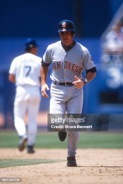 John Flaherty of the San Diego Padres runs back to the dugout during an MLB game against the Los Angeles Dodgers circa 1996 at Dodger Stadium in Los...