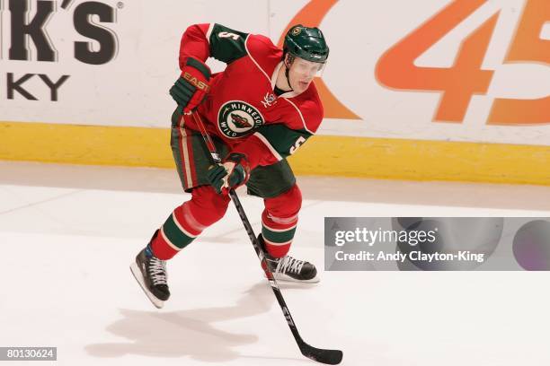 Kim Johnsson of the Minnesota Wild handles the puck against the Los Angeles Kings during the game at Xcel Energy Center on March 2, 2008 in Saint...