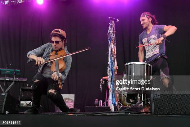 Musicians Zambricki Li and Austin Bisnow of Magic Giant perform onstage during Arroyo Seco Weekend at Brookside Golf Course on June 25, 2017 in...