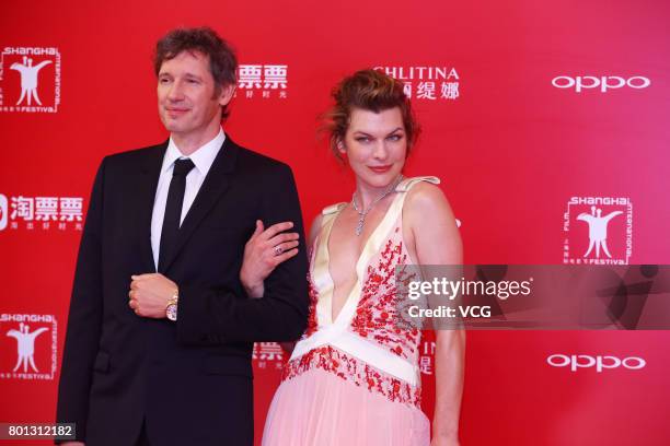 English director Paul William Scott Anderson and his wife American actress Milla Jovovich arrive at red carpet of Golden Goblet Awards and Closing...