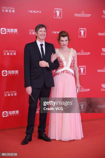 English director Paul William Scott Anderson and his wife American actress Milla Jovovich arrive at red carpet of Golden Goblet Awards and Closing...