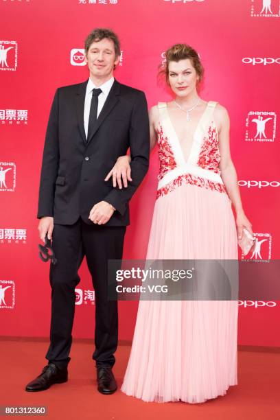 English director Paul William Scott Anderson and his wife American actress Milla Jovovich arrive at red carpet of Golden Goblet Awards and Closing...