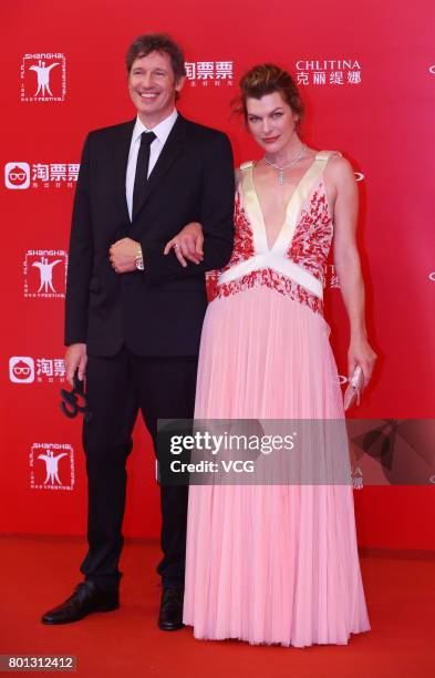 English director Paul William Scott Anderson and his wife American actress Milla Jovovich arrive at red carpet of Golden Goblet Awards and Closing...