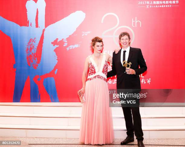 English director Paul William Scott Anderson and his wife American actress Milla Jovovich arrive at red carpet of Golden Goblet Awards and Closing...