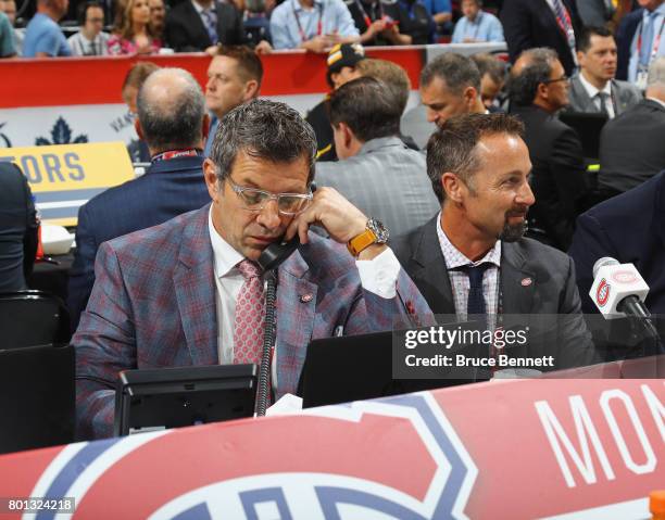 Mark Bergevin and Trevor Timmins of the Montreal Canadiens work the 2017 in Chicago, Illinois.