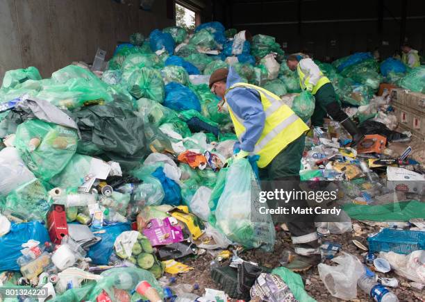 Collected rubbish and litter is processed at the Glastonbury Festival's purpose built Recycling Centre as festival goers leave the Glastonbury...