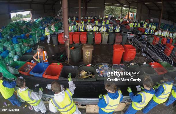Collected rubbish and litter is processed at the Glastonbury Festival's purpose built Recycling Centre as festival goers leave the Glastonbury...