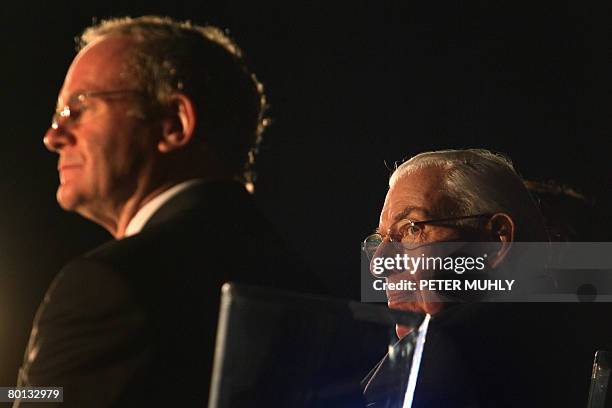 Northern Ireland's first minister Ian Paisley sits with Deputy First Minister Martin McGuiness on March 5, 2008 during the celebration of the...