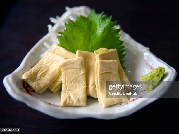 yuba sashimi, tofu skin served in fan-shaped porcelain plate - nata de soja fotografías e imágenes de stock