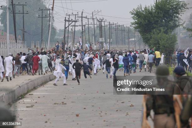 Kashmiri protesters clash with police and paramilitary soldiers after Eid-Ul-Fitr prayers at Eidgah, on June 26, 2017 in Srinagar, India. Eid prayers...