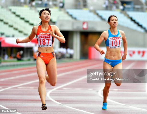 Winner Kana Ichikawa and 5th finish Chisato Fukushima react after the Women's 200m during day three of the 101st JAAF Athletics Championships at...