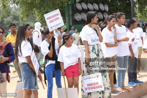 School children during a Delhi road safety activity to spread awareness on anti-drunken driving and anti-stunt riding, organised by Delhi Traffic...