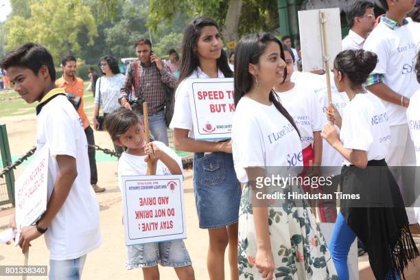 School children during a Delhi road safety activity to spread awareness on anti-drunken driving and anti-stunt riding, organised by Delhi Traffic...