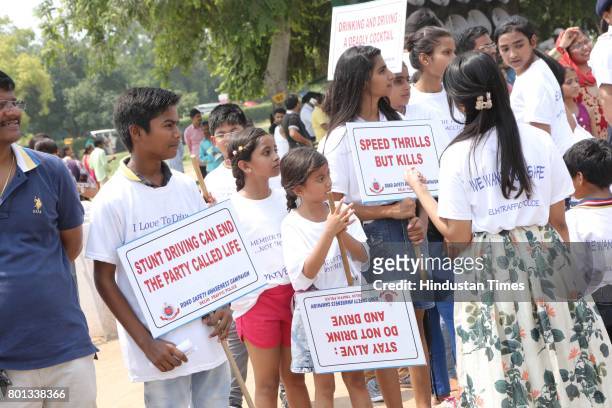 School children during a Delhi road safety activity to spread awareness on anti-drunken driving and anti-stunt riding, organised by Delhi Traffic...