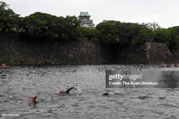 Participants swim at a moat during the Osaka Castle Triathlon on June 25, 2017 in Osaka, Japan.