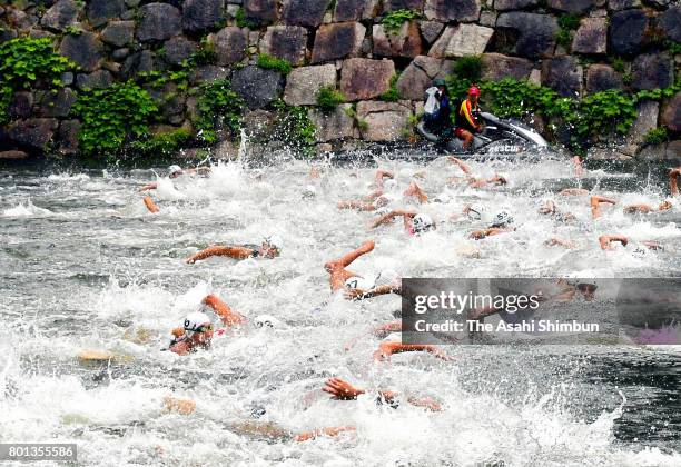 Participants swim at a moat during the Osaka Castle Triathlon on June 25, 2017 in Osaka, Japan.