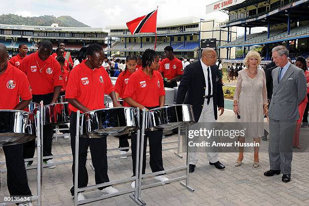 Prince Charles, Prince of Wales and Camilla, Duchess of Cornwall meet tin pan drum players during a visit to Queen's Park Cricket Ground in Trinidad...