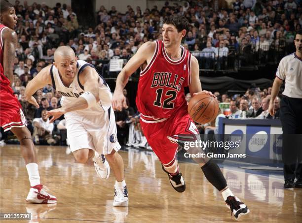 Kirk Hinrich of the Chicago Bulls drives against Jason Kidd of the Dallas Mavericks at the American Airlines Center on February 25, 2008 in Dallas,...