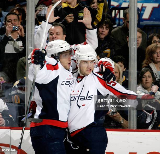 Alex Ovechkin and Mike Green of the Washington Capitals celebrate Ovechkin's goal in the first period against the Buffalo Sabres on March 5, 2008 at...