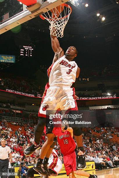 Dwyane Wade of the Miami Heat dunks against the Toronto Raptors on March 5, 2008 at the American Airlines Arena in Miami, Florida. NOTE TO USER: User...