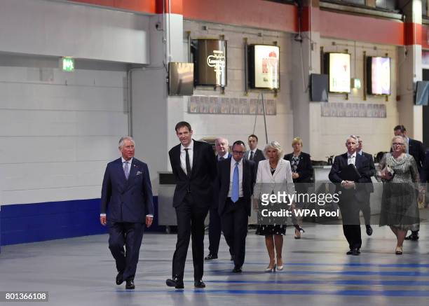 Prince Charles, Prince of Wales and his wife Camilla, Duchess of Cornwall , are escorted through Manchester Arena to meet with people who helped the...