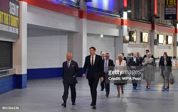 Britain's Prince Charles, Prince of Wales and his wife Britain's Camilla, Duchess of Cornwall , are escorted through Manchester Arena in Manchester,...