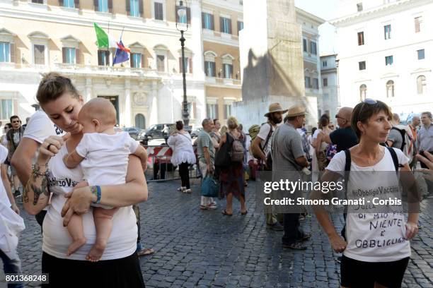 Mother with baby during the demonstration in front of Parliament against the Compulsory vaccination issued by the Government, on June 26, 2017 in...