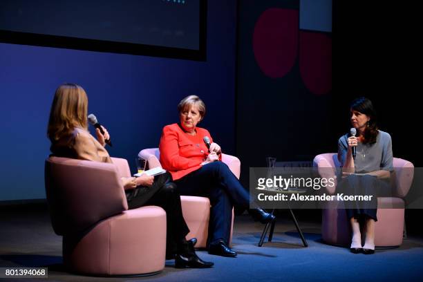 Meike Dinklage, German chancellor Angela Merkel and Brigitte Huber speak on stage during the Brigitte Live Event at Maxim Gorki Theater on June 26,...