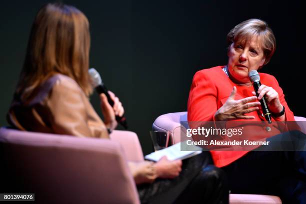 Meike Dinklage and German chancellor Angela Merkel speak on stage during the Brigitte Live Event at Maxim Gorki Theater on June 26, 2017 in Berlin,...