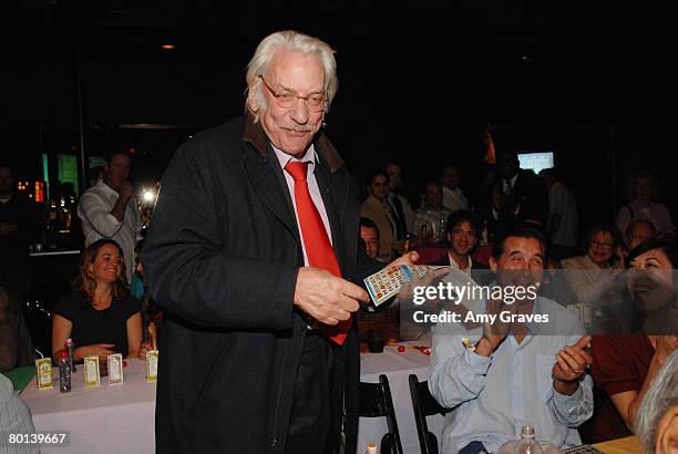 Actor Donald Sutherland wins the first round of Bingo as actor Billy Baldwin looks on at the Painted Turtle Bingo Night at the Roxy on March 5, 2008...