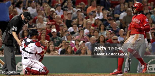 Los Angeles Angels left fielder Cameron Maybin walks home on a Balk call on Boston Red Sox pitcher Fernando Abad, not pictured, as Boston Red Sox...