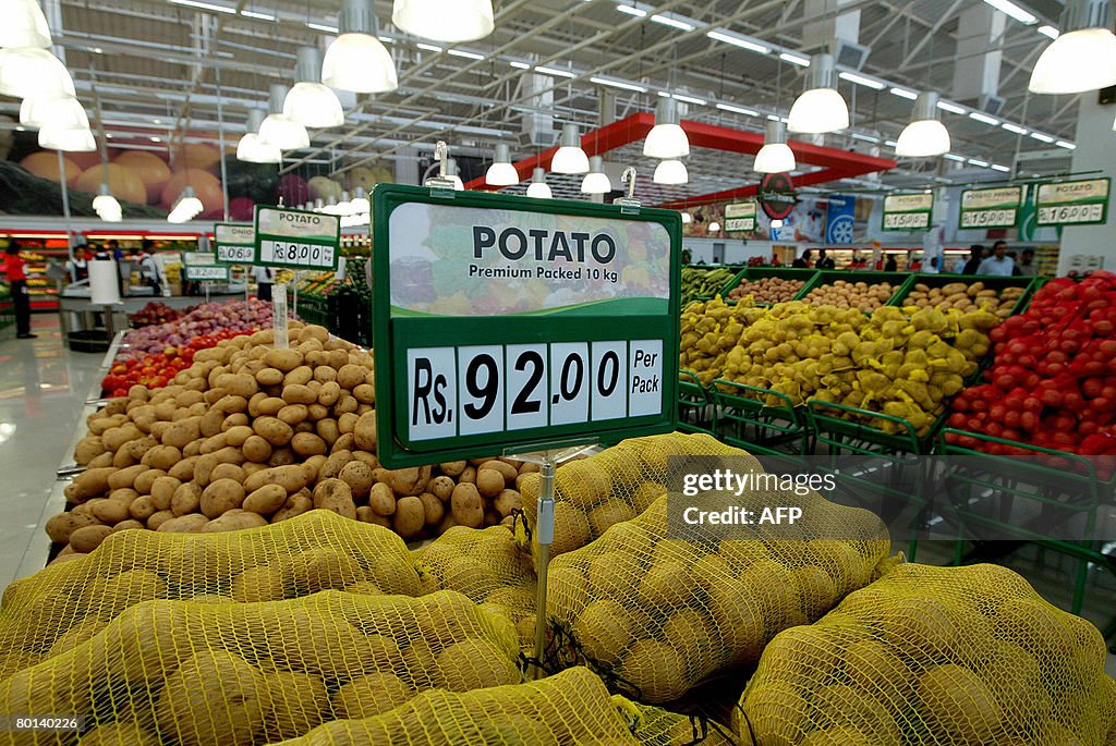 A display of vegetables with prices in I