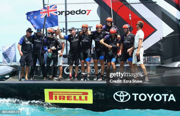 Emirates Team New Zealand helmed by Peter Burling celebrate after winning the America's Cup Match Presented by Louis Vuitton on June 26, 2017 in...