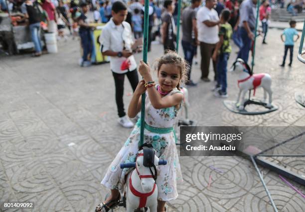 Children enjoy at unknown soldier Park in Gaza during the Eid al-Fitr on July 26, 2017. Muslims around the world are celebrating the Eid al-Fitr...