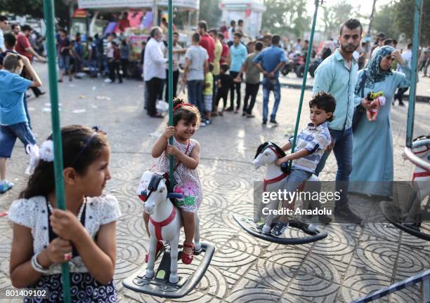 Children enjoy at unknown soldier Park in Gaza during the Eid al-Fitr on July 26, 2017. Muslims around the world are celebrating the Eid al-Fitr...