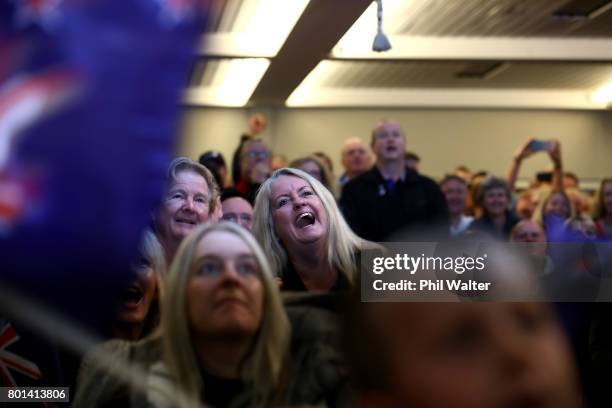 Team New Zealand supporters celebrate as they watch the racing at the Royal New Zealand Yacht Squadron as Team New Zealand win the Americas Cup over...