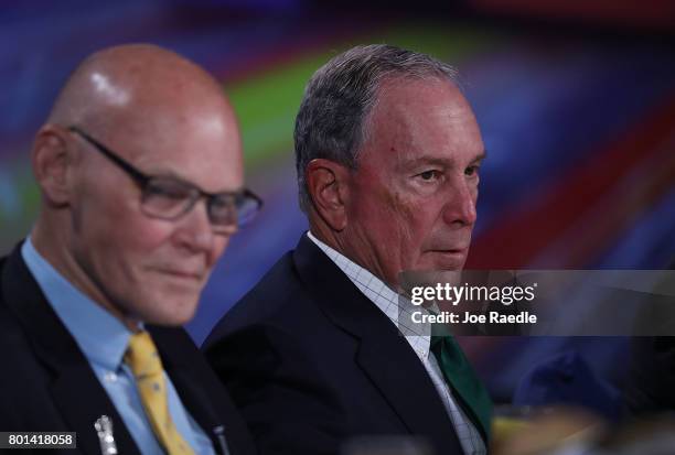 Former New York City Mayor Michael Bloomberg sits with James Carville before addressing the United States Conference of Mayors at the Fountainebleau...