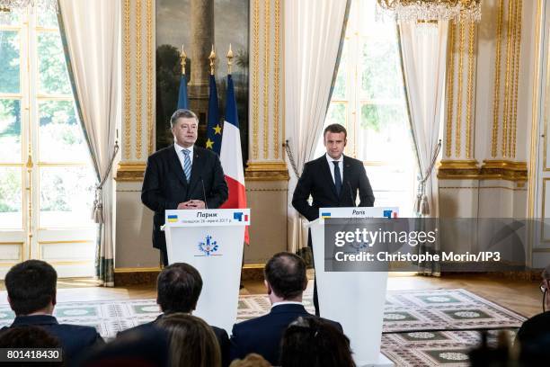 French President Emmanuel Macron receives Ukrainian President Petro Porochenko for a meeting and a press conference at the Elysee Palace on June 26,...