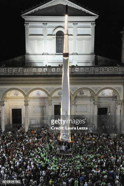 Men carry a 25-metre tall wood and papier-mache statue called 'giglio' during the annual Festa dei Gigli on June 25, 2017 in Nola, Italy. When St....