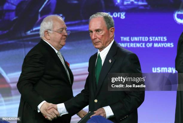 Former New York City Mayor Michael Bloomberg shakes hands with Tom Cochran, Mayor of Columbia, SC. Second Vice President, CEO and Executive Director...