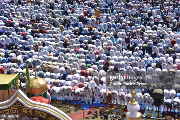 Indian Muslim devotees offer Eid prayers at the start of the Eid al-Fitr, marking the end of Ramadan at the Eid Gah mosque in Guwahati. Muslims...