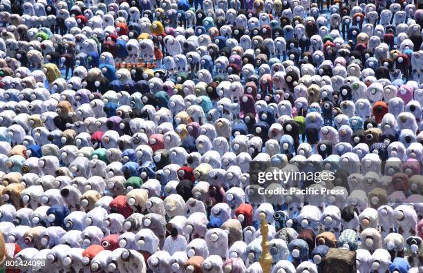 Indian Muslim devotees offer Eid prayers at the start of the Eid al-Fitr, marking the end of Ramadan at the Eid Gah mosque in Guwahati. Muslims...