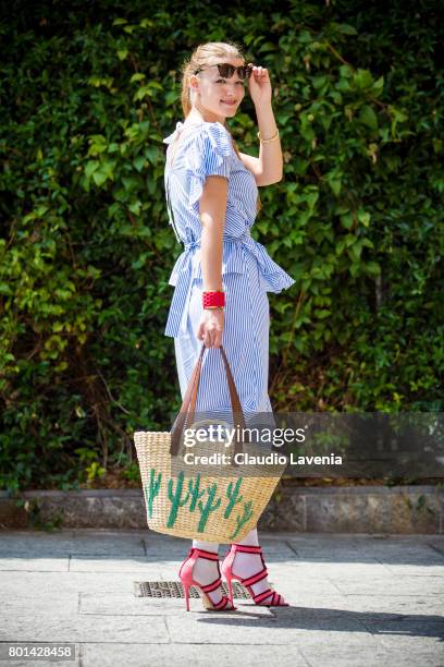 Fasion stylist and blogger Angelina Lepper wears a Cote white and blue striped top and skirt, Mango bag, Manfredi Manara pink shoes and Colonsay...