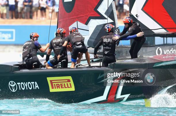 Glenn Ashby skipper of Emirates Team New Zealand congratulates helmsman Peter Burling after winning race 9 against Oracle Team USA to win the...