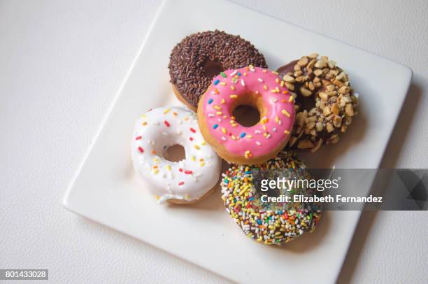 donuts - square plate stock pictures, royalty-free photos & images