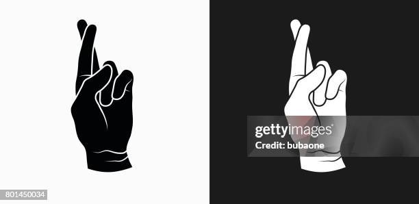 fingers crossed icon on black and white vector backgrounds - fingers crossed stock illustrations