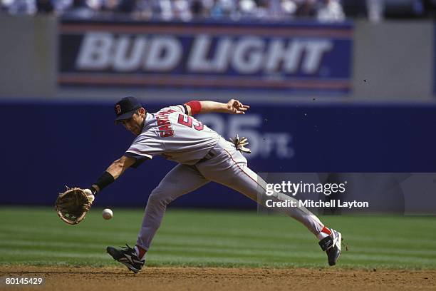 Nomar Garciaparra of the Boston Red Sox fields a ground ball during a baseball game against the Chicago White Sox on June 1, 1998 at Comiskey Park in...