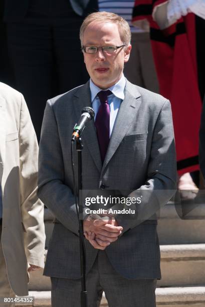 Leader of Islington Council Richard Watts delivers a speech after standing in silence for the victims of the Finsbury Park terrorist attack outside...