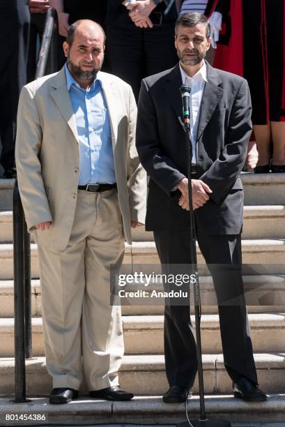 Chairman of Finsbury Park Mosque Mohammed Kozbar and CEO of Muslim Welfare House Toufik Kacimi deliver speeches after standing in silence for the...